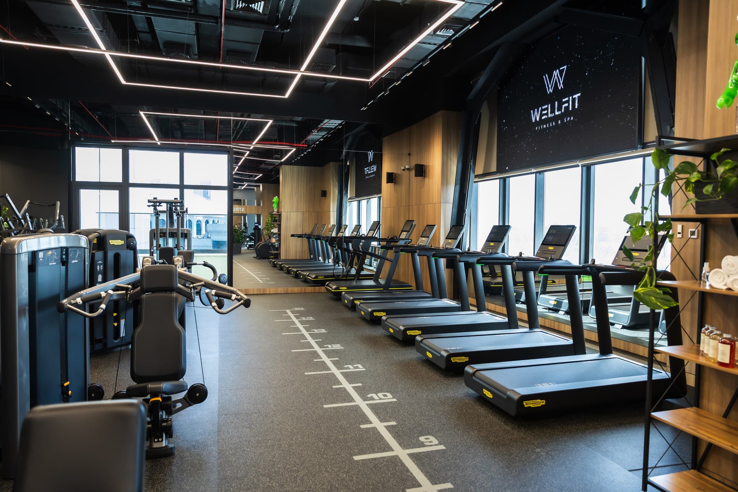 Indoor training track and strength floor at WellFit.uz Fitness & Spa